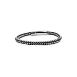 Male bracelet made from steel combined with leather.